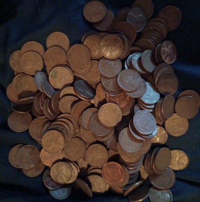 INDIAN HEAD CENT showing on one end of old unsearched white us wheat penny roll coins estate lot hoard collection coin sale money